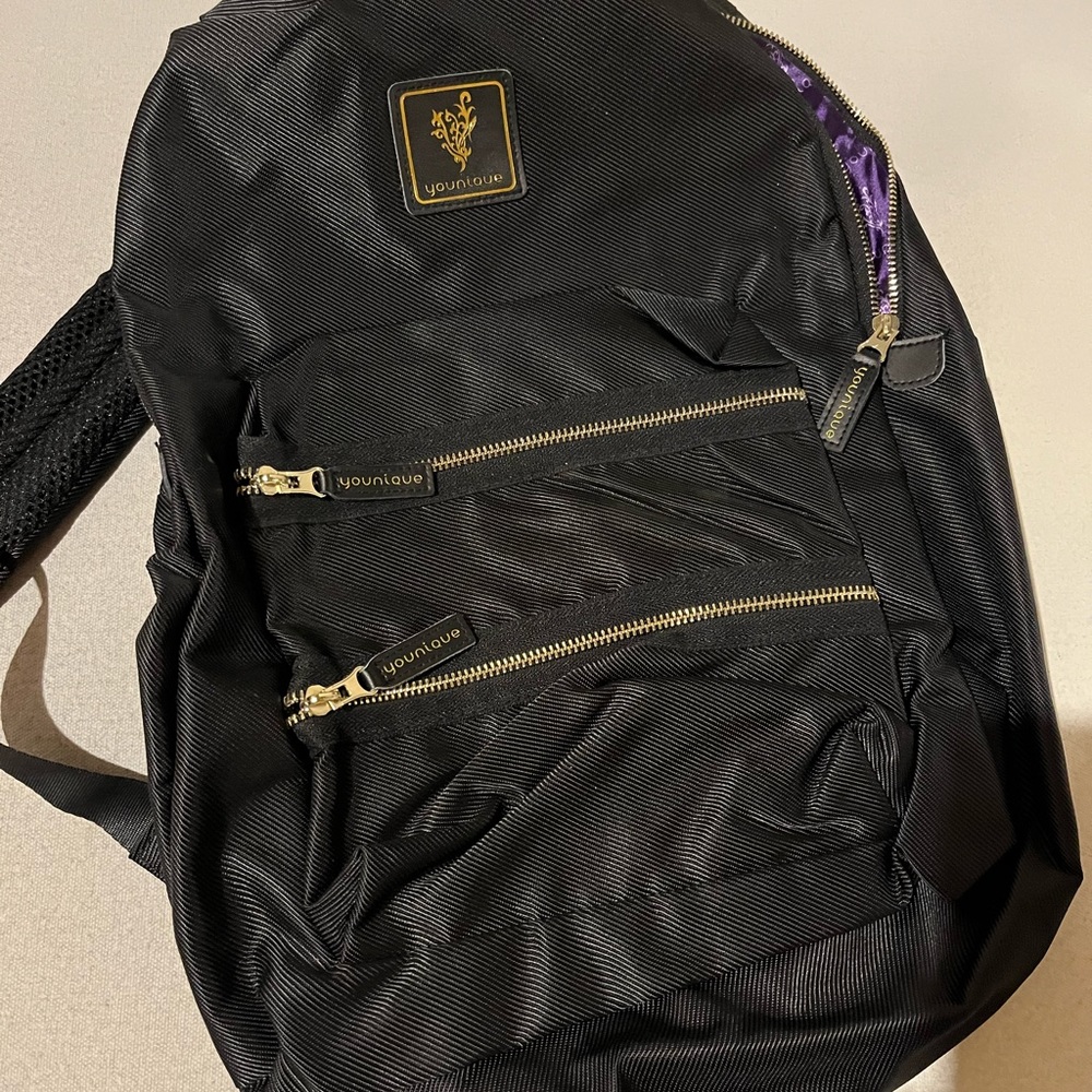 Younique black backpack with gold trim
